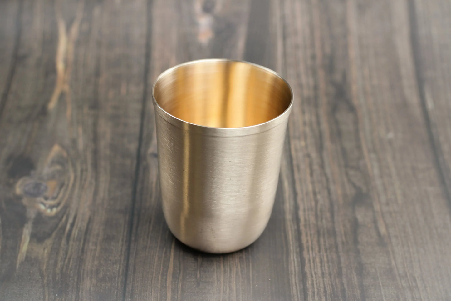 Elegant bronze artisan sipper glass by Kansyakar with glossy and matte finish, 200ml and 250ml capacity.