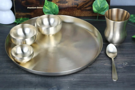 Bronze Kansyakar 6-piece curvy dinner set with matte finish, includes bowls and plates made of pure bronze.