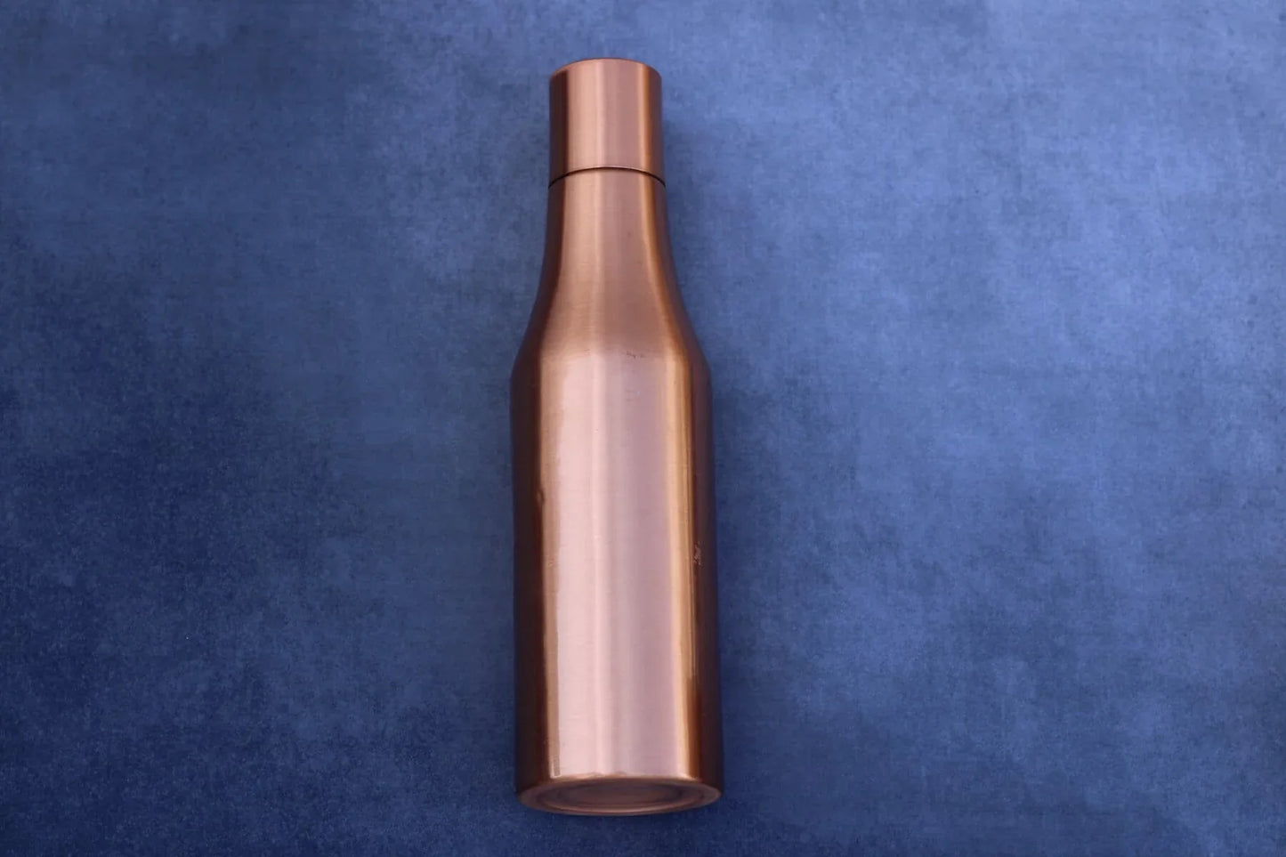 Matte finish copper Sanjivani bottle, 1000ml with elegant seamless design, showcasing a sleek and stylish water bottle.