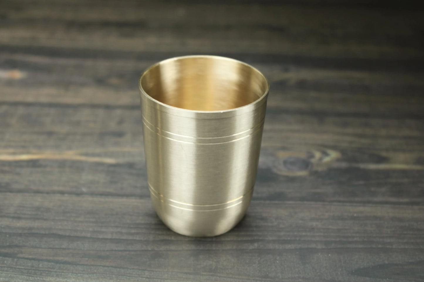 Artisan bronze sipper glass with textured ring design, glossy and matte finish, 200ml or 250ml capacity by Kansyakar