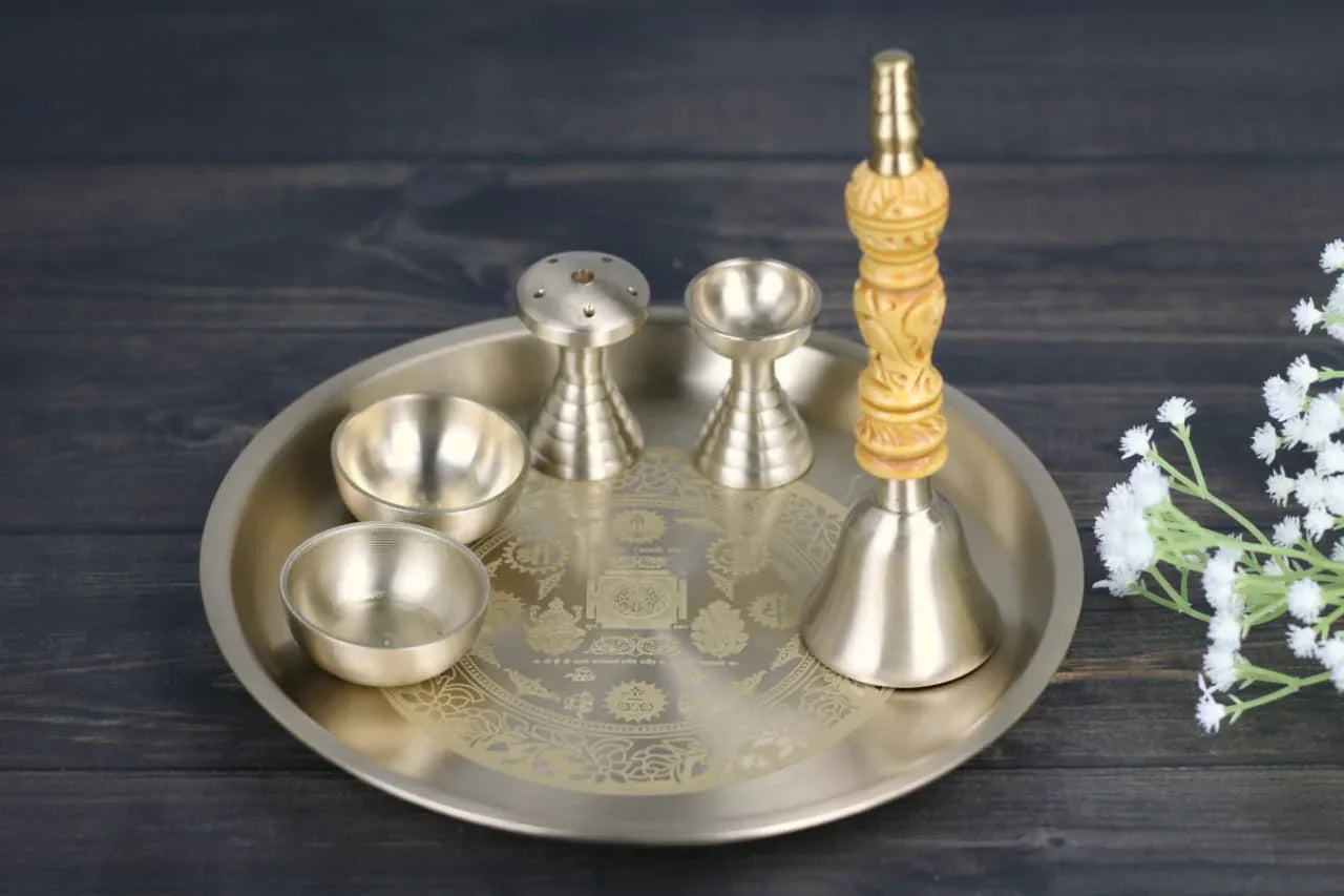 Bronze Aaradhya Pooja Set with 6 pieces including thali, diya, bell, kumkum vati, engraved Lakshmi and Ganesh symbols.