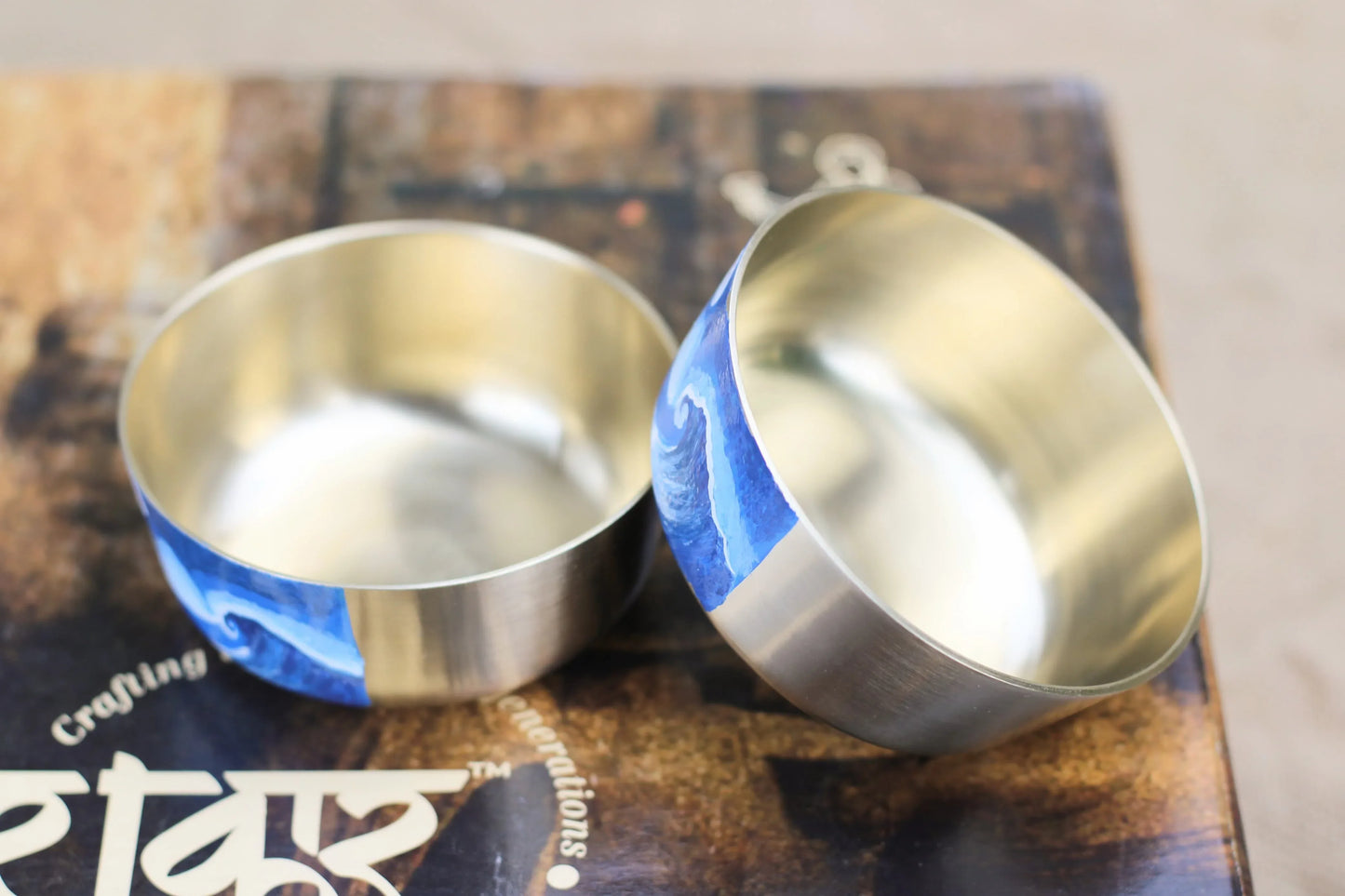 Hand-painted bronze bowl with ocean wave design by Kansyakar, 150ml, ideal for home decor and puja rituals.