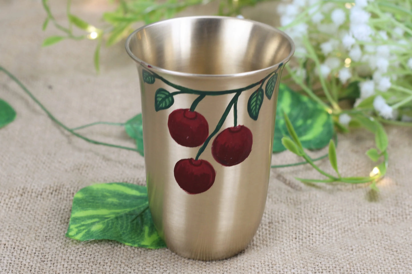 Bronze glass nectar tumbler by Kansyakar with cherry fruit hand-painted design, 220ml capacity, matte finish, metallic juice tumbler.