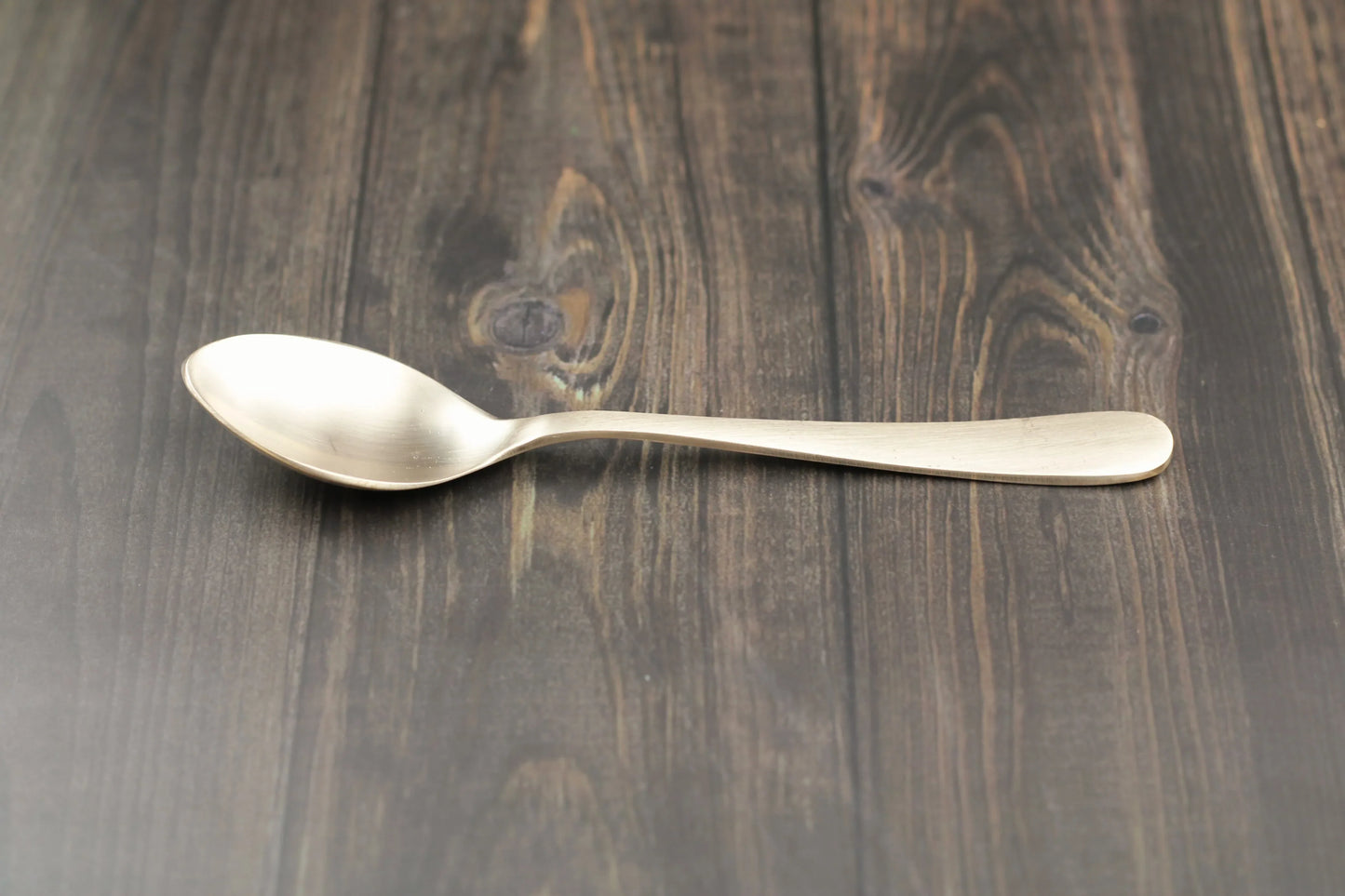 Kansyakar artisan bronze dessert spoon with glossy and matte finish, 6.75-inch elegant scoop, 70g weight.