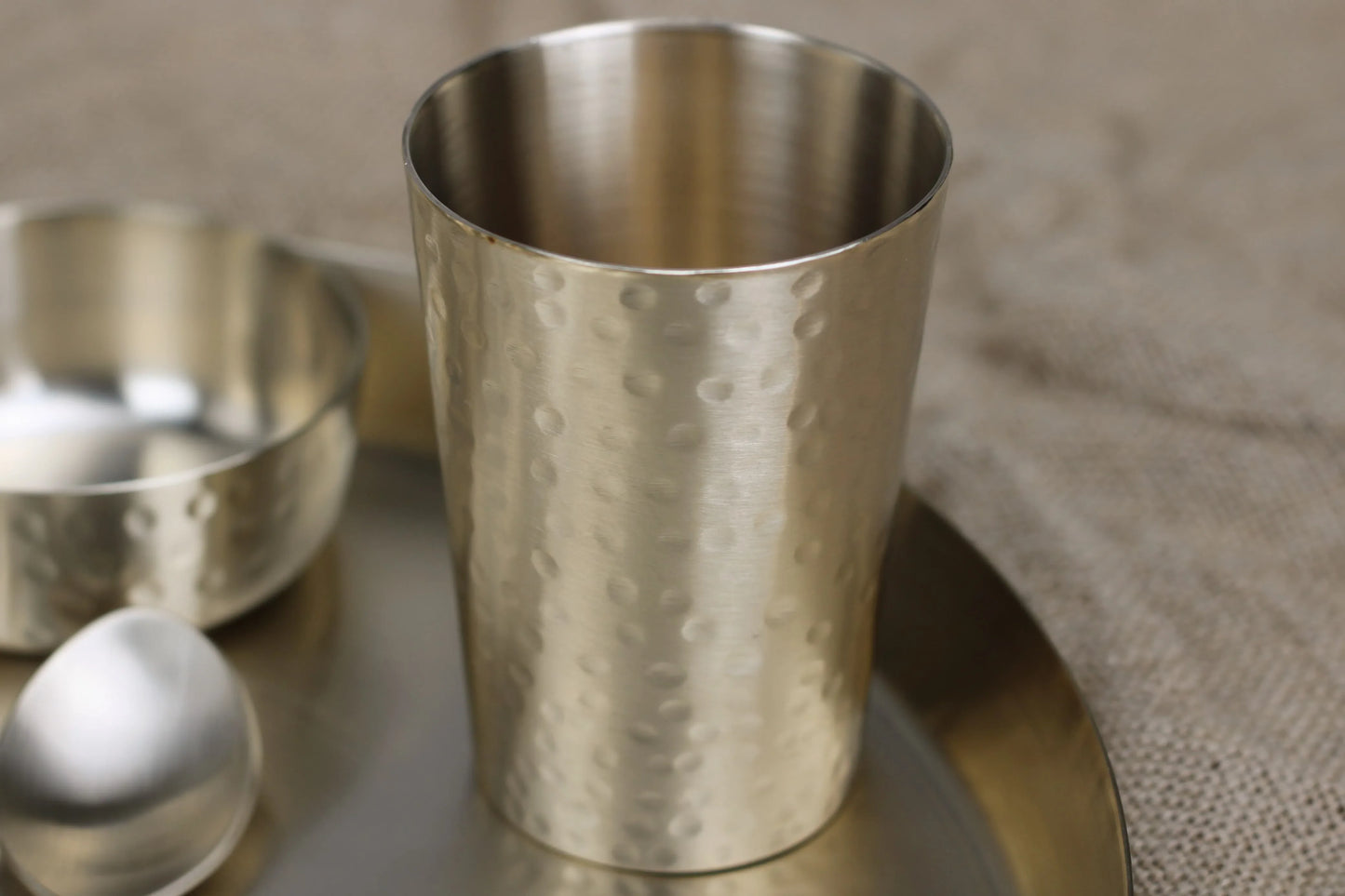 Handcrafted bronze hammered Luxe tumbler by Kansyakar, 220ml glossy and matte juice or cocktail glass with textured finish.