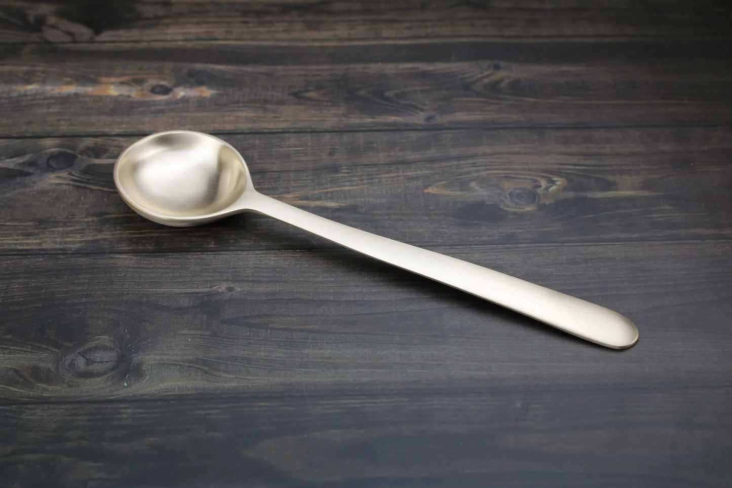 Kansyakar artisan bronze Karchi serving spoon, 10.25 inches long, professional kitchen essential with a sleek bronze finish.