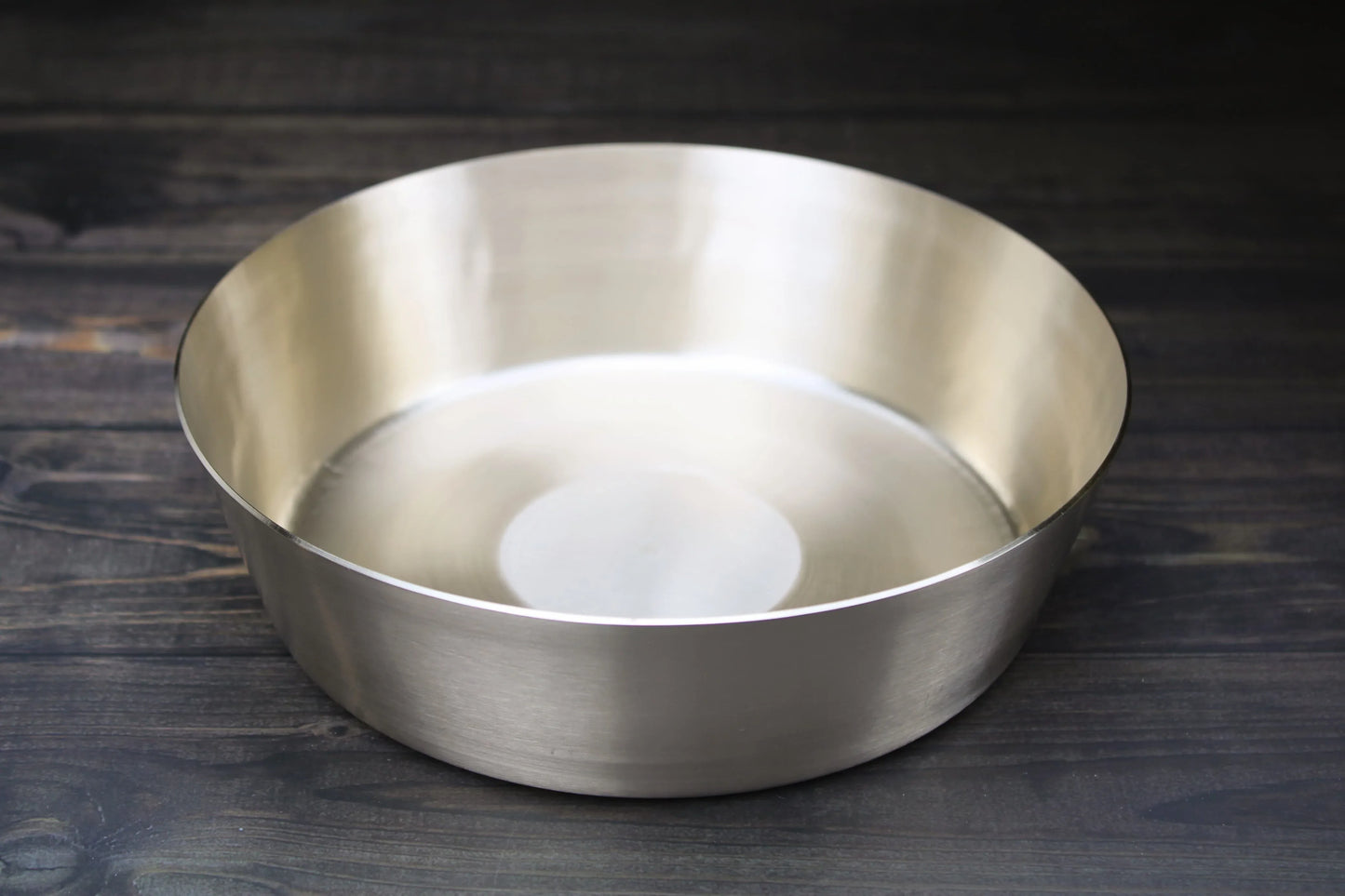 Kathiyawadi bronze thali and artisan serving bowls from Kansyakar, perfect for feasts and decorative table settings.