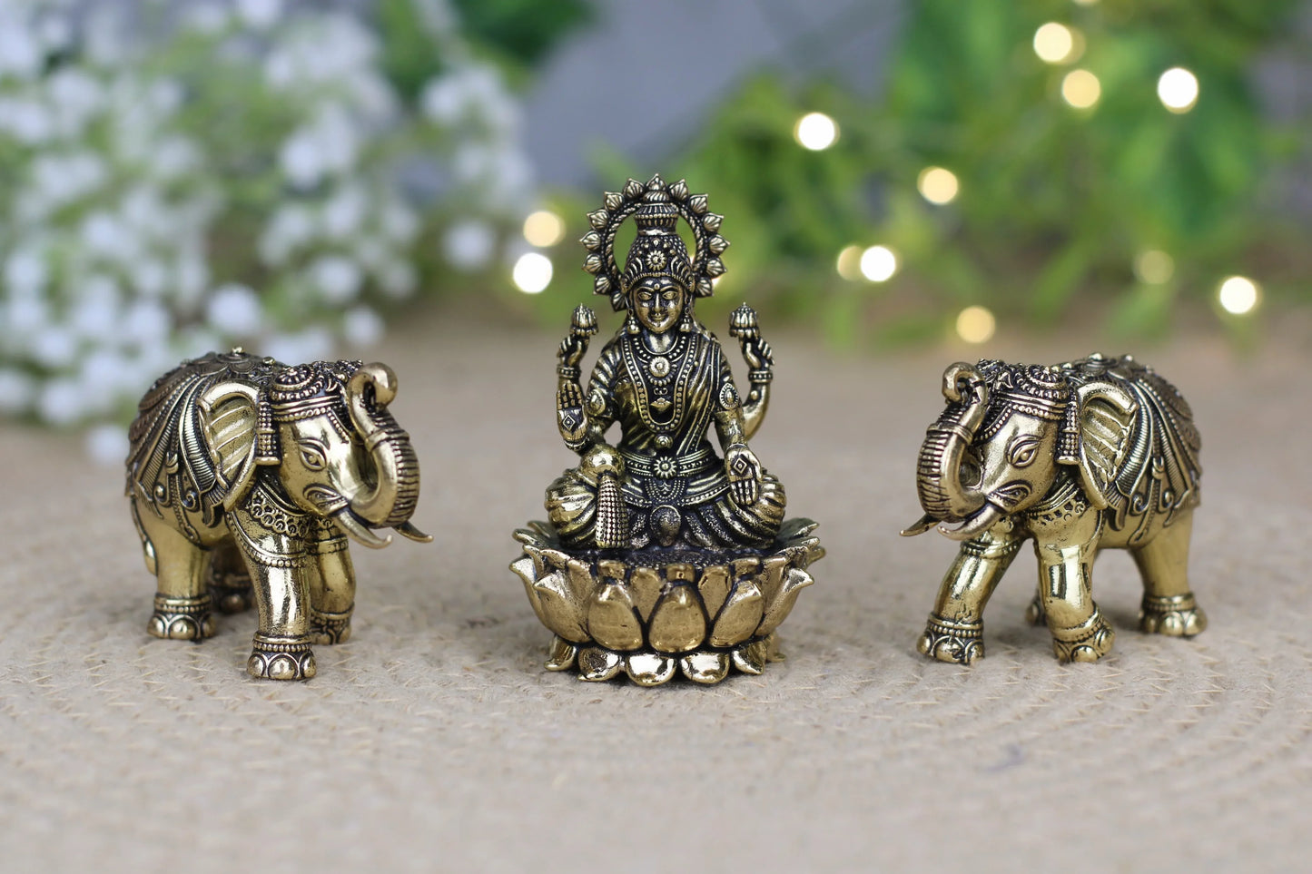 Premium brass Lakshmi idol with elephants, antique finish, part of Kansyakar 3-piece puja and décor set, showcasing intricate craftsmanship.