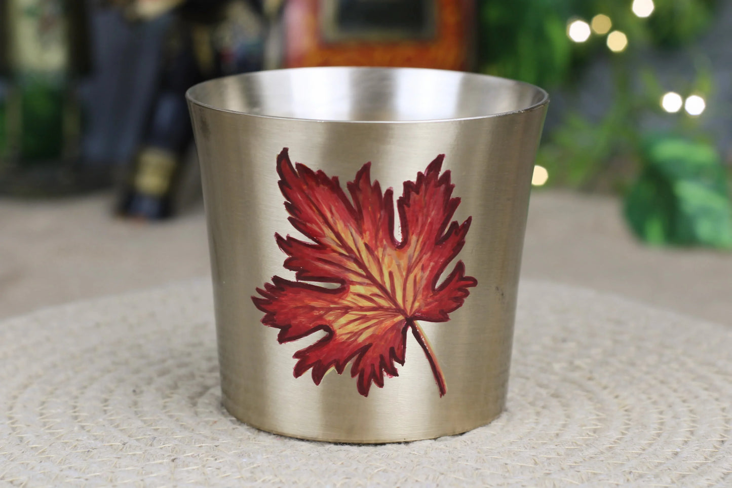 Handmade bronze drinking tumbler with red-yellow maple leaf design, food-safe, matte finish, by Kansyakar.