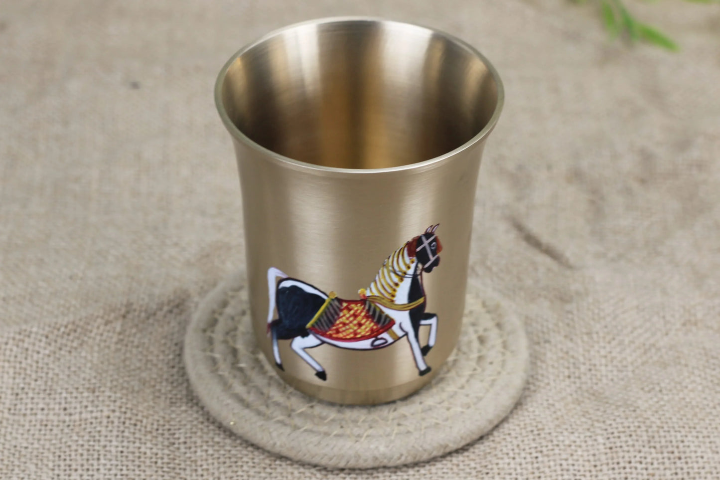 Decorative bronze tumbler featuring Mughlai horse design, hand-painted in bronze, 220 ml capacity, by Kansyakar.