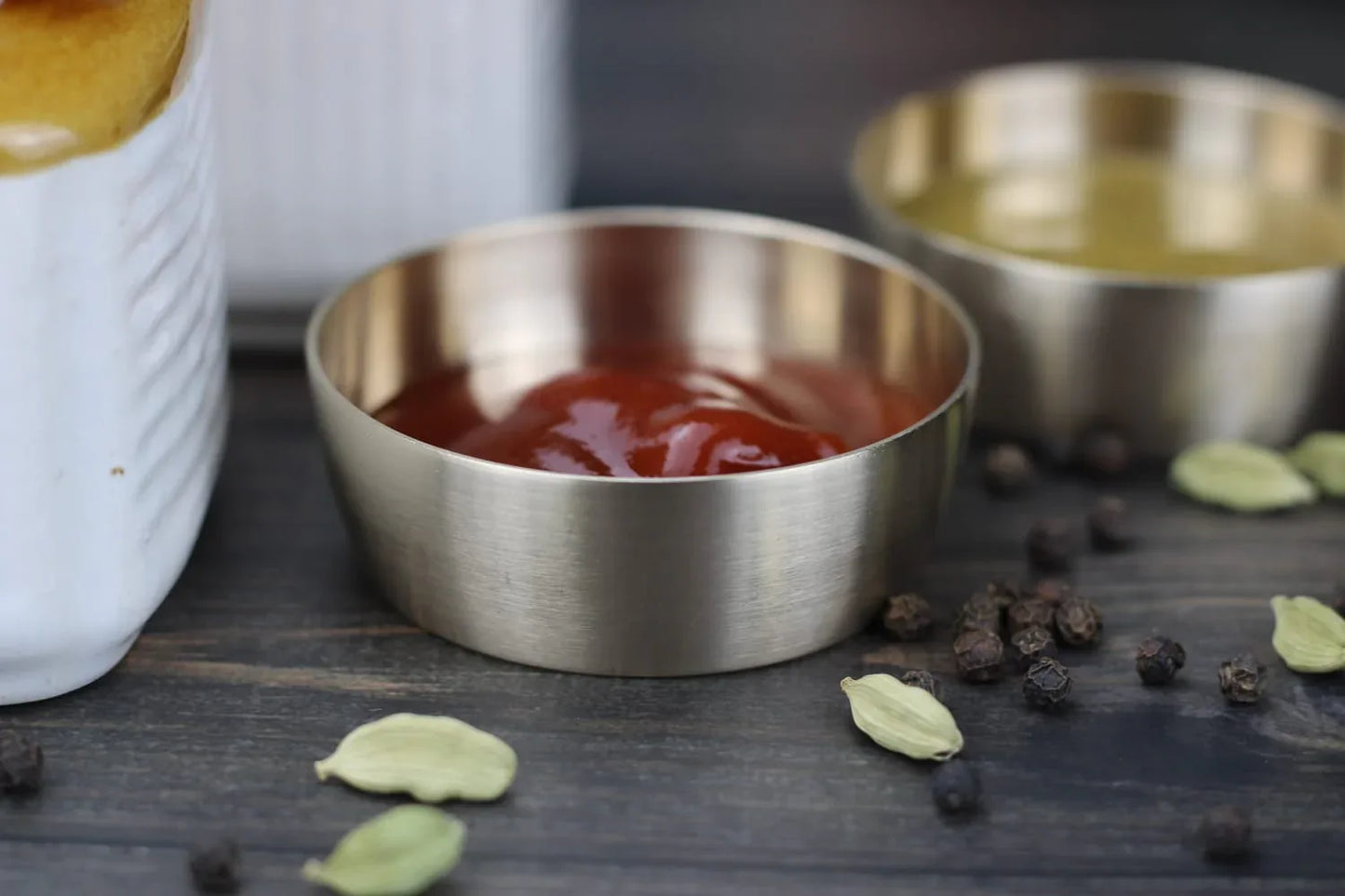 Petite bronze sauce bowl by Kansyakar, an elegant chutney and condiment dish with intricate detailing on a white background.