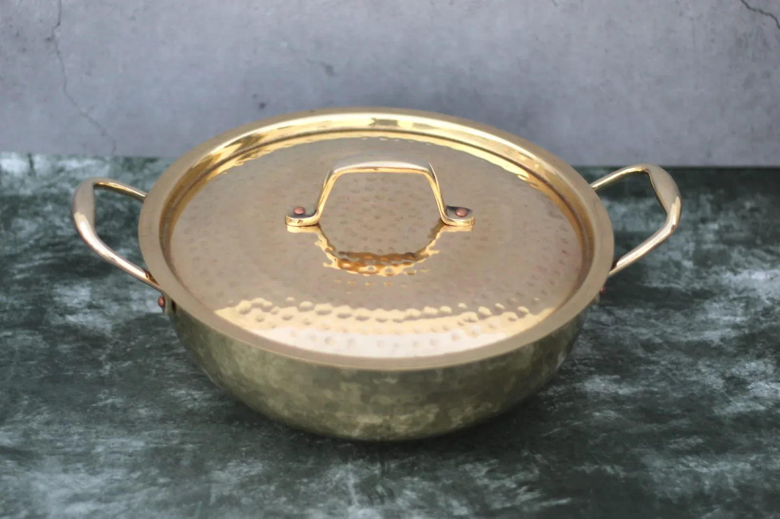 Brass Kadai with lid and handles, glossy hammered finish, traditional tin-coated cooking wok by Kansyakar, ideal for versatile cooking.