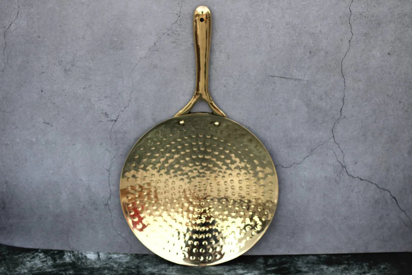 Hammered pure brass Tawa for roti and paratha, traditional curved flatbread griddle by Kansyakar, artisan brass cookware.
