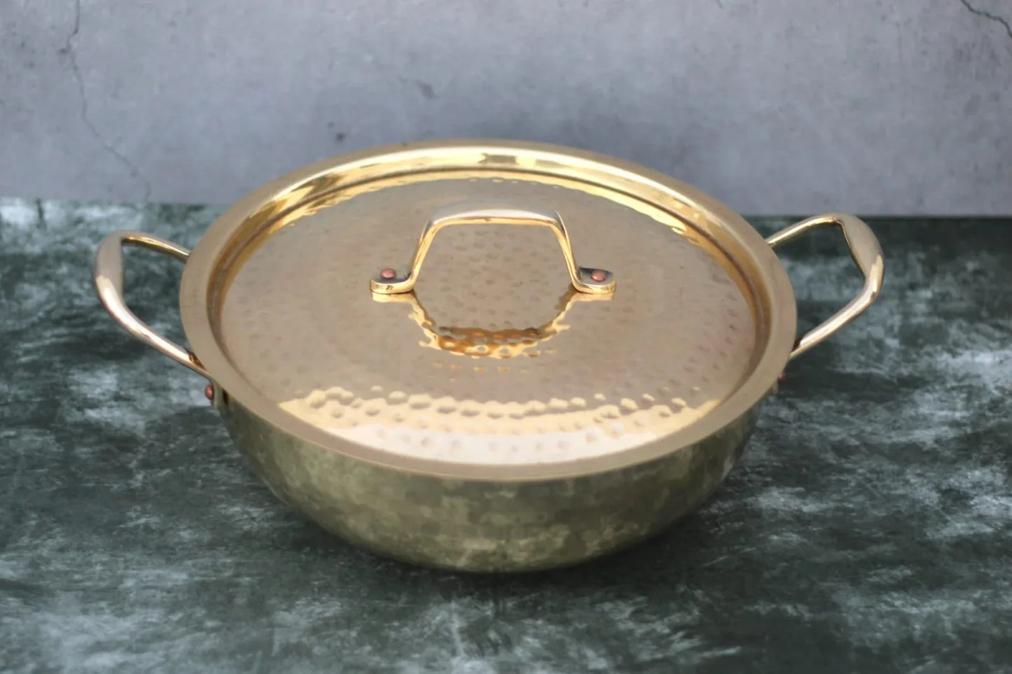 Brass Kadai with lid and handles, glossy hammered finish, traditional cooking wok by Kansyakar, suitable for versatile kitchen use