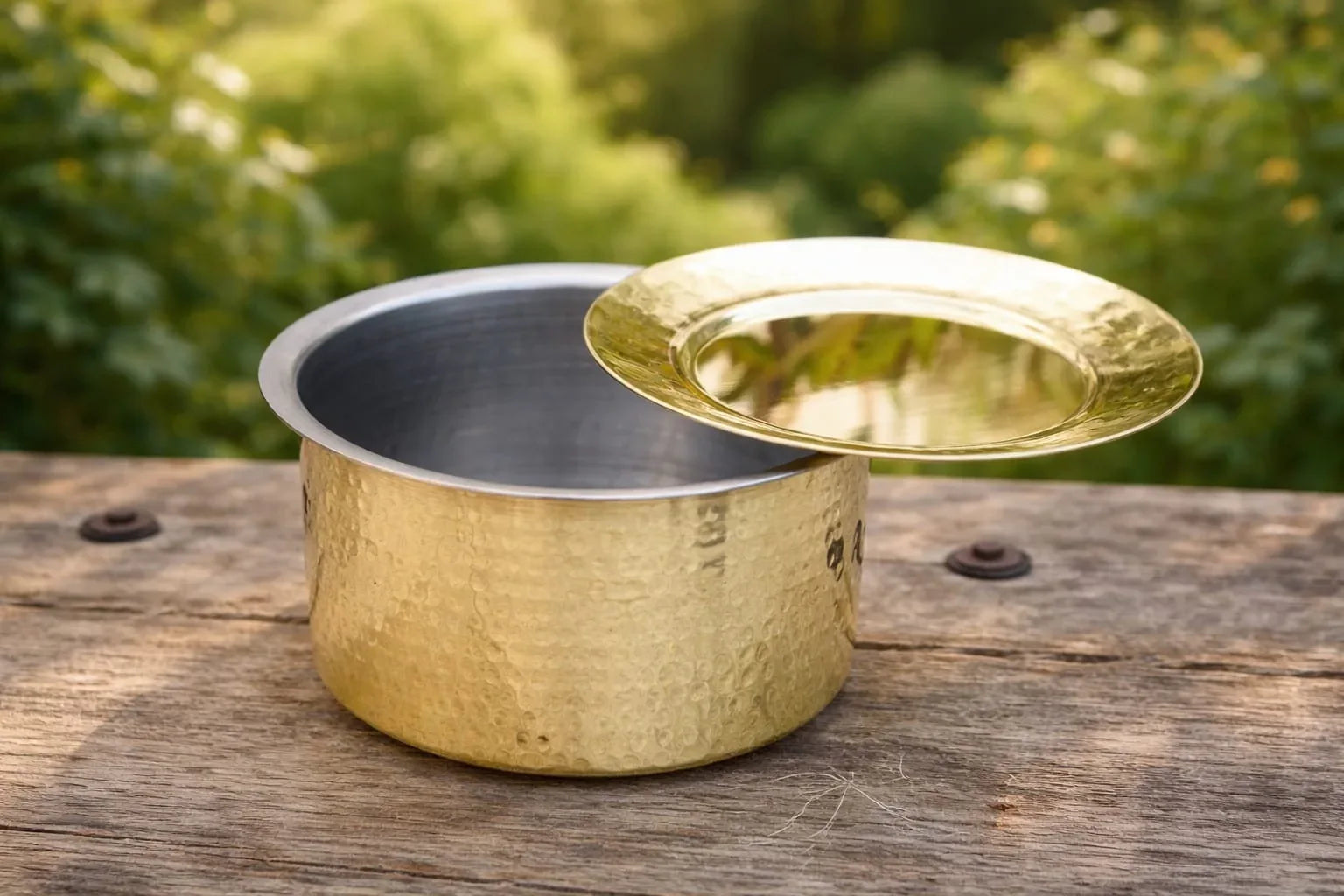 Set of three handcrafted brass Patila pots with tin coating and lids, ideal for cooking and boiling in traditional style.